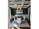 Formal dining room with table and chairs beneath an elegant chandelier at 1317 Pecora Ln, Raleigh, NC 27607