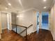 Upper hallway features hardwood floors, recessed lighting, and access to various rooms in the home at 1317 Pecora Ln, Raleigh, NC 27607