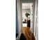Charming hallway features hardwood floors, decorative trim, and a glimpse into a beautifully decorated room at 1317 Pecora Ln, Raleigh, NC 27607