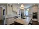 Gourmet kitchen with stainless steel appliances, island with sink, and gas range at 1317 Pecora Ln, Raleigh, NC 27607