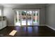 Bright and airy living room with hardwood floors and sliding glass doors to the backyard at 1317 Pecora Ln, Raleigh, NC 27607