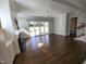 Open concept living room featuring a fireplace, ceiling fan, and glass doors leading to a backyard at 1317 Pecora Ln, Raleigh, NC 27607