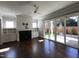 Bright living room with a fireplace, built-in cabinets, and sliding glass doors to the backyard at 1317 Pecora Ln, Raleigh, NC 27607