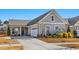 Charming home with a two-car garage, gray siding, and manicured landscaping at 1416 Monterey Bay Dr, Wake Forest, NC 27587