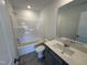 Bright bathroom featuring a bathtub with shower, toilet, and vanity with countertop and sink at 1551 Crescent Townes Way, Raleigh, NC 27604