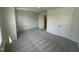 The bedroom features neutral carpet, white doors, and lots of natural light from the window at 1551 Crescent Townes Way, Raleigh, NC 27604