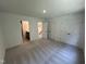 Spacious bedroom with neutral carpet, bright lighting, and convenient access to bathroom and hallway at 1551 Crescent Townes Way, Raleigh, NC 27604