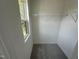 Walk-in closet featuring carpeted floor, wire shelving, and a window at 1551 Crescent Townes Way, Raleigh, NC 27604
