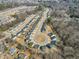 Aerial view of a residential neighborhood with well-maintained homes and tree-lined streets at 162 W Lumber Ct, Clayton, NC 27520