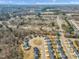 Extensive aerial shot of a residential area, showcasing numerous homes among lush greenery at 162 W Lumber Ct, Clayton, NC 27520