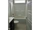 Bathroom showcasing a white tub, shower and sink with dark cabinets at 162 W Lumber Ct, Clayton, NC 27520