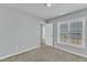 Bedroom featuring neutral paint, carpet, a window with blinds, and doorways at 162 W Lumber Ct, Clayton, NC 27520