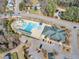 Aerial view of a community pool featuring slides, a lap pool and splash pad for the residents in the neighborhood at 162 W Lumber Ct, Clayton, NC 27520