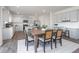 Dining area featuring a wooden table and chairs, next to a modern kitchen space at 1752 Post Oak Dr, Haw River, NC 27258