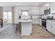 Bright kitchen with granite countertops, stainless steel appliances, and a view to the outside patio at 1752 Post Oak Dr, Haw River, NC 27258