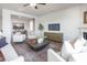 Open-concept living area with a dining table, modern furnishings, and lots of natural light for comfortable living at 1752 Post Oak Dr, Haw River, NC 27258