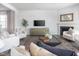 Inviting living room with a TV, fireplace, and stylish decor creates a comfortable gathering area at 1752 Post Oak Dr, Haw River, NC 27258