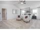 Spacious main bedroom with a four-poster bed, seating area, and plenty of natural light at 1752 Post Oak Dr, Haw River, NC 27258