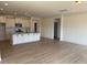 Open concept kitchen with granite countertops and stainless appliances and hardwood floors at 190 Sage Ln # 015, Four Oaks, NC 27524