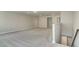 Upstairs loft or bonus room with neutral carpet and access to other rooms at 190 Sage Ln # 015, Four Oaks, NC 27524
