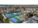 Aerial view of a community, including tennis courts, swimming pool, and pond at 200 Indian Elm Ln, Cary, NC 27519