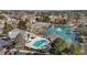 Aerial view of community with pool, lake, tennis courts, and clubhouse at 200 Indian Elm Ln, Cary, NC 27519