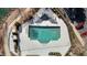 Aerial shot of pool area with lounge chairs and a jacuzzi at 200 Indian Elm Ln, Cary, NC 27519