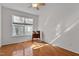 Well-lit bedroom with hardwood floors and a window letting in lots of natural light at 200 Indian Elm Ln, Cary, NC 27519