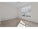 A large bedroom with neutral carpet and a big window at 200 Indian Elm Ln, Cary, NC 27519