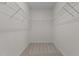 A bright walk-in closet with installed storage racks at 200 Indian Elm Ln, Cary, NC 27519