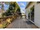 Wood deck with railing, showing the exterior of the house and trees at 200 Indian Elm Ln, Cary, NC 27519