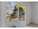 View of a wood deck with railing, seen through a sliding glass door at 200 Indian Elm Ln, Cary, NC 27519