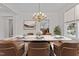 Dining room showcasing a marble table and elegant chandelier, perfect for gatherings at 200 Indian Elm Ln, Cary, NC 27519