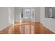 Bright room with a bay window, hardwood floors, and natural light streaming in at 200 Indian Elm Ln, Cary, NC 27519