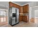 Kitchen featuring stainless steel refrigerator and wooden cabinets at 200 Indian Elm Ln, Cary, NC 27519