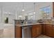 Kitchen area with stainless steel appliances, and an open view of the living room at 200 Indian Elm Ln, Cary, NC 27519