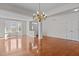 Spacious living room with hardwood floors, a bay window, and an open layout at 200 Indian Elm Ln, Cary, NC 27519