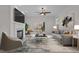 Bright living room features a fireplace, ceiling fan and sliding door to deck at 200 Indian Elm Ln, Cary, NC 27519