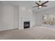 Spacious living room with fireplace and sliding doors to the wood deck at 200 Indian Elm Ln, Cary, NC 27519