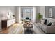 Comfortable living room with a bay window, stylish furniture, and light-colored walls at 200 Indian Elm Ln, Cary, NC 27519