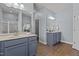 Elegant bathroom with dual vanities, modern fixtures, and a separate shower, offering convenience and style at 2007 Bunnfield Dr, Zebulon, NC 27597