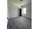 Bedroom with carpet, window, and view of closet, providing ample space at 209 Deodora Ln, Cameron, NC 28326
