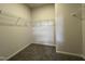 Spacious walk-in closet featuring carpeted floors and white wire shelving for optimal organization at 209 Deodora Ln, Cameron, NC 28326