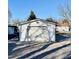 Detached one-car garage with a single garage door and gravel parking at 212 Craig Ave, Henderson, NC 27537