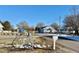 Street view of the quiet neighborhood with scattered snow on the ground at 212 Craig Ave, Henderson, NC 27537