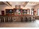 The bar area features a rustic stone counter and seating at 2325 Ballywater Lea Way, Wake Forest, NC 27587