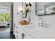 Bright bathroom features double vanity, modern fixtures, and open view to bedroom at 2325 Ballywater Lea Way, Wake Forest, NC 27587