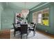 Elegant dining room featuring a stylish chandelier, modern decor, and plenty of natural light at 2325 Ballywater Lea Way, Wake Forest, NC 27587
