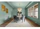 Bright and airy dining room with a statement chandelier, modern wall decor, and an inviting ambiance at 2325 Ballywater Lea Way, Wake Forest, NC 27587