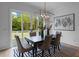 A dining room boasts natural light, stylish decor, and seamless access to the outdoor deck, perfect for dining at 2325 Ballywater Lea Way, Wake Forest, NC 27587